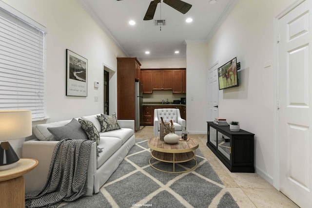 tiled living room with crown molding and ceiling fan