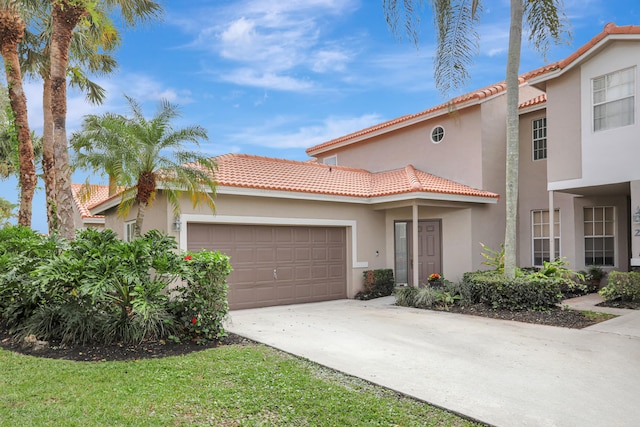 mediterranean / spanish-style home featuring a garage