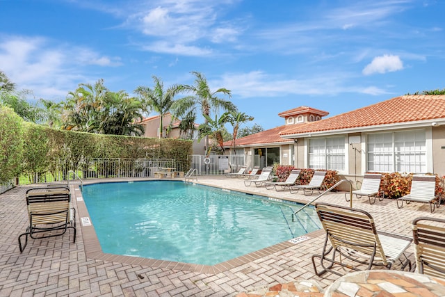 view of swimming pool with a patio area