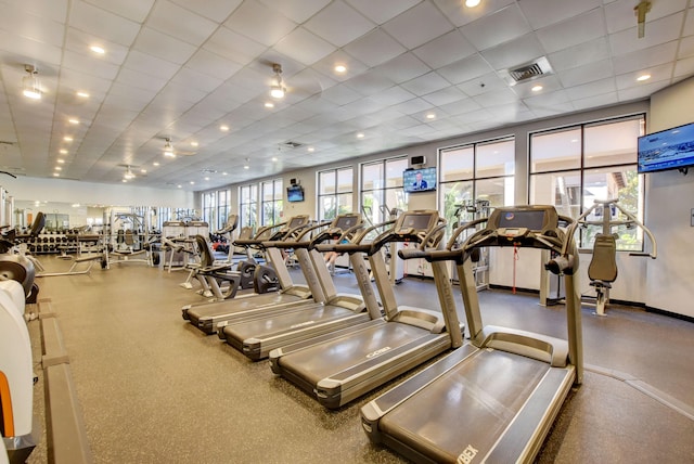 exercise room featuring a drop ceiling