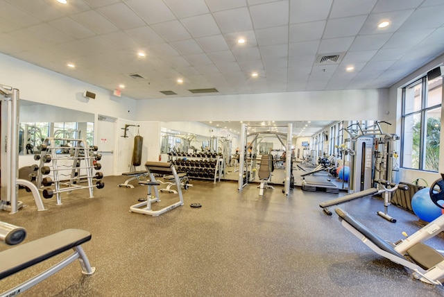 workout area featuring a paneled ceiling