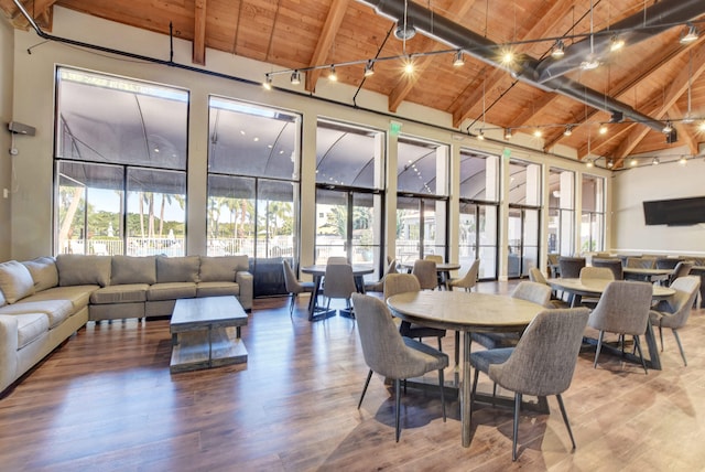 interior space featuring lofted ceiling with beams and wooden ceiling