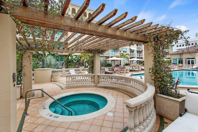 view of pool featuring a pergola, a hot tub, and a patio area