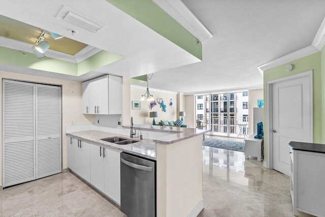 kitchen with kitchen peninsula, sink, decorative light fixtures, dishwasher, and white cabinetry