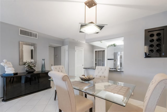 dining room featuring light tile floors