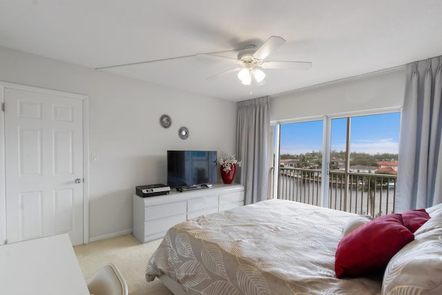 carpeted bedroom with ceiling fan and access to outside