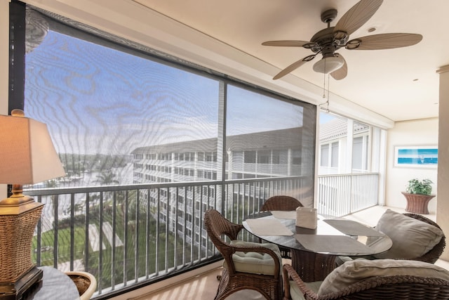 sunroom with ceiling fan and a wealth of natural light