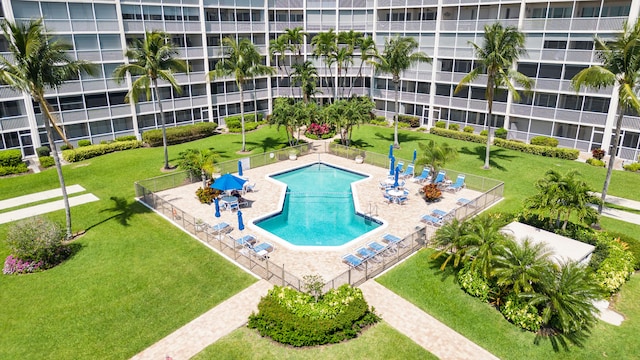 view of pool featuring a lawn and a patio area