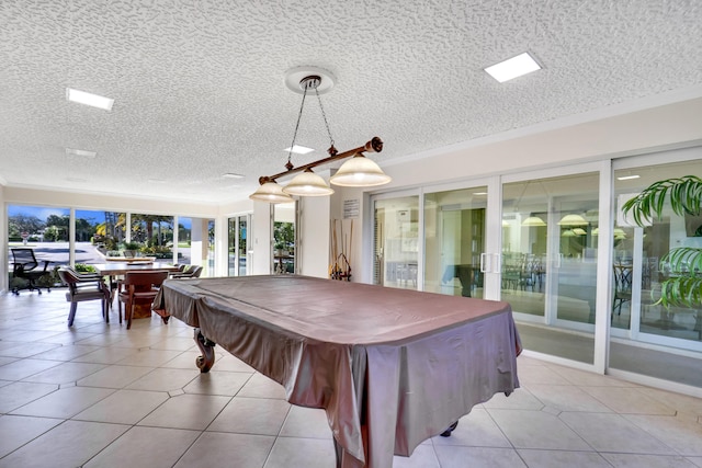 playroom with light tile flooring, a textured ceiling, and billiards