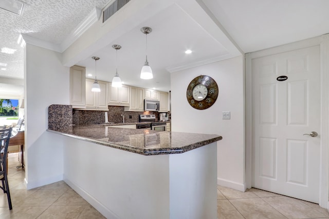 kitchen with kitchen peninsula, hanging light fixtures, ornamental molding, appliances with stainless steel finishes, and backsplash