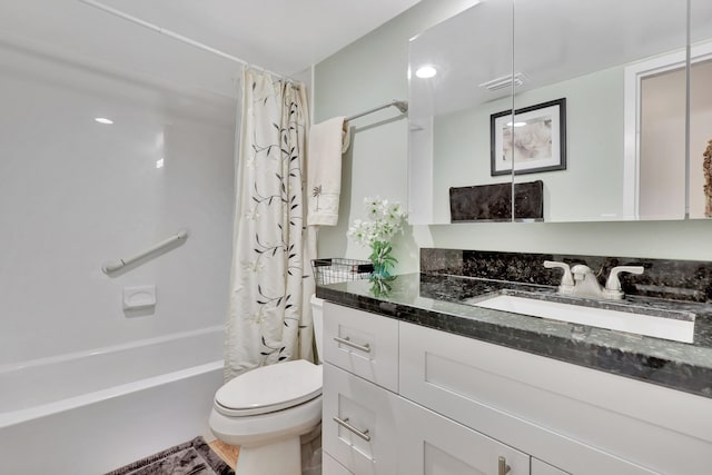 full bathroom with shower / bath combo, toilet, and large vanity