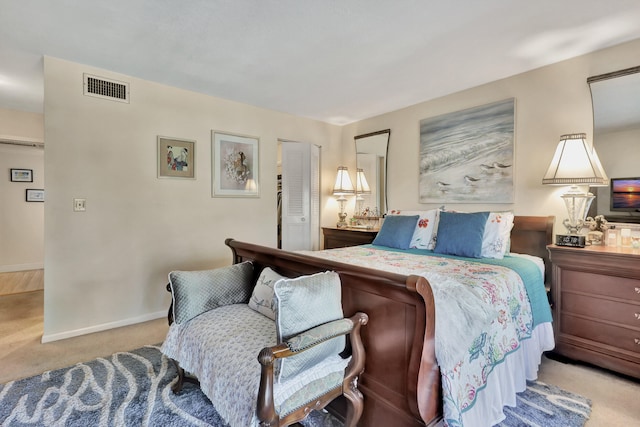 bedroom featuring light colored carpet