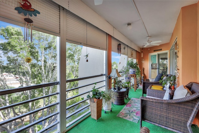 sunroom / solarium with ceiling fan and a wealth of natural light