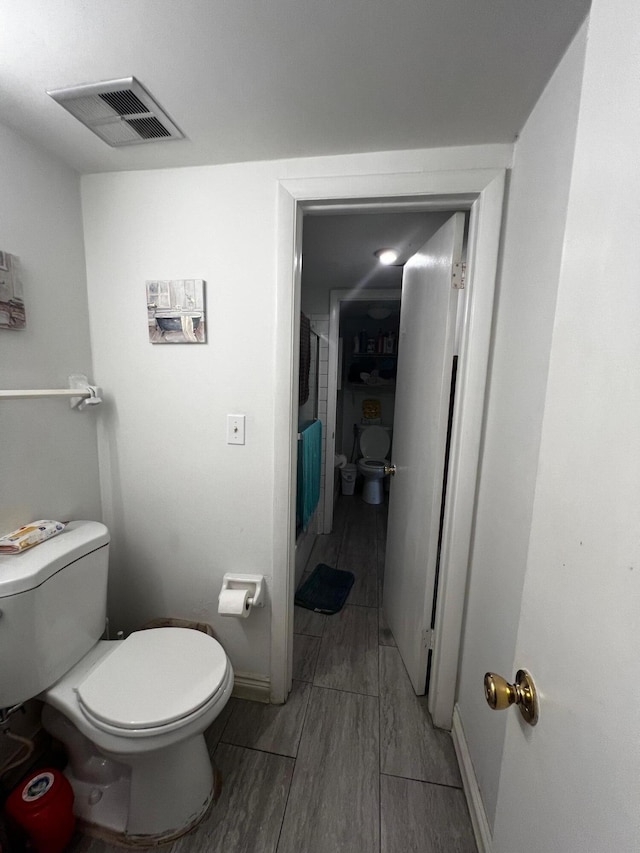 bathroom featuring toilet