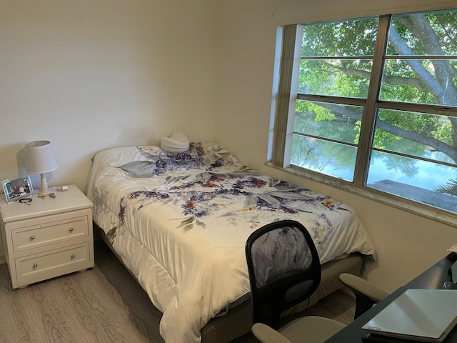 bedroom with light hardwood / wood-style flooring