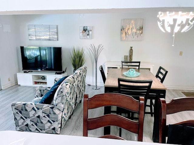 dining space featuring light wood-type flooring