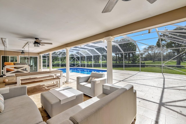 view of patio featuring glass enclosure and an outdoor hangout area