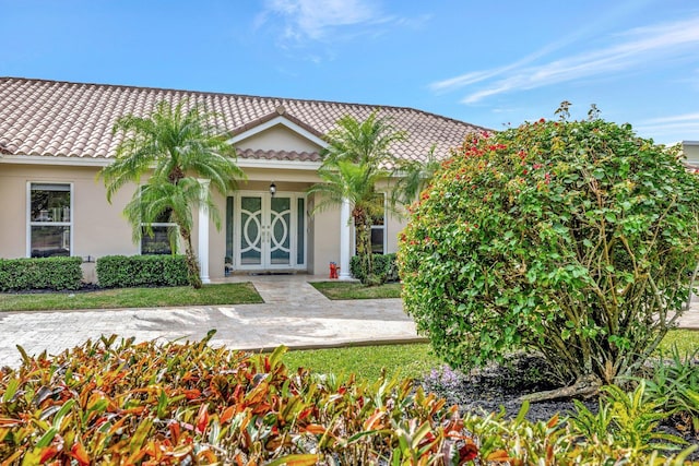 9010 S Lake Dasha Dr, Plantation, FL 33324 - entrance to property featuring a tile roof and stucco siding