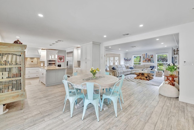 dining area with light hardwood / wood-style flooring