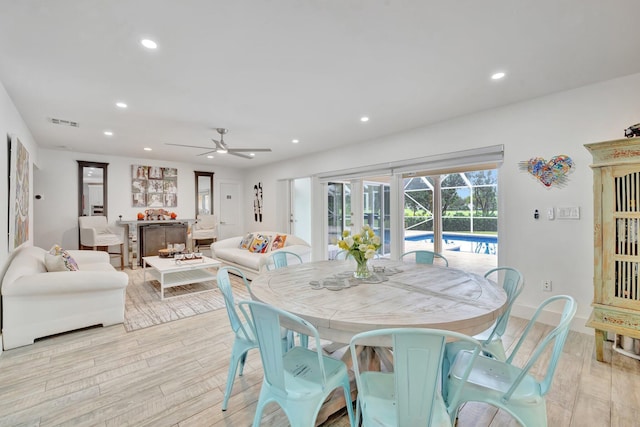 dining space featuring ceiling fan and light hardwood / wood-style floors