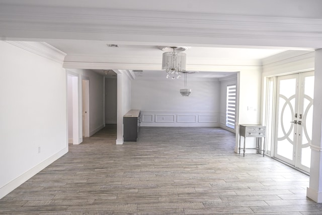 9010 S Lake Dasha Dr, Plantation, FL 33324 - interior space with plenty of natural light, wood finished floors, ornamental molding, french doors, and a chandelier