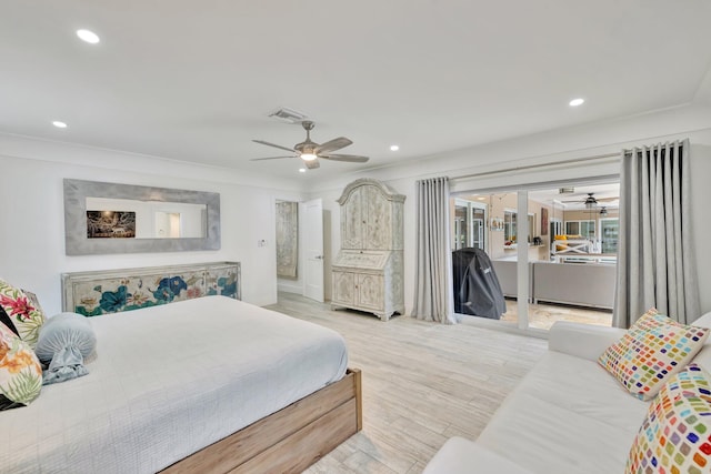 bedroom with ceiling fan, light wood-type flooring, and ornamental molding