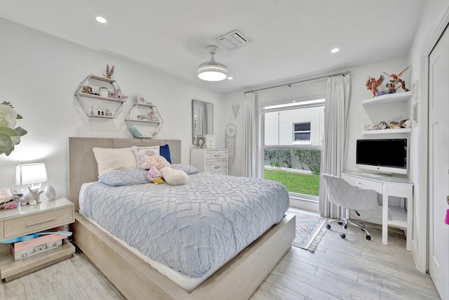 bedroom featuring hardwood / wood-style flooring