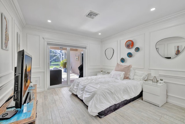 bedroom featuring access to outside, crown molding, and light wood-type flooring