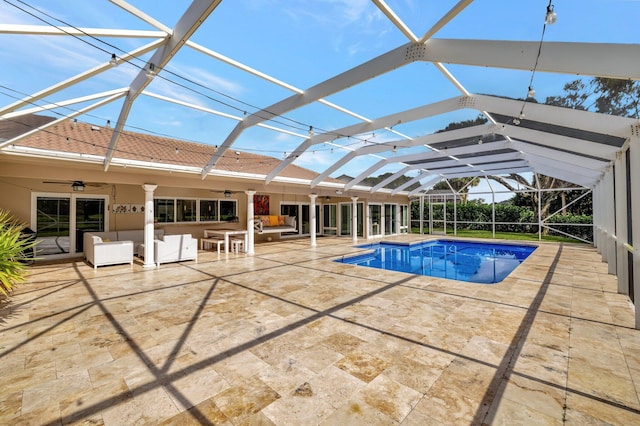 view of swimming pool featuring an outdoor hangout area, a patio area, ceiling fan, and a lanai