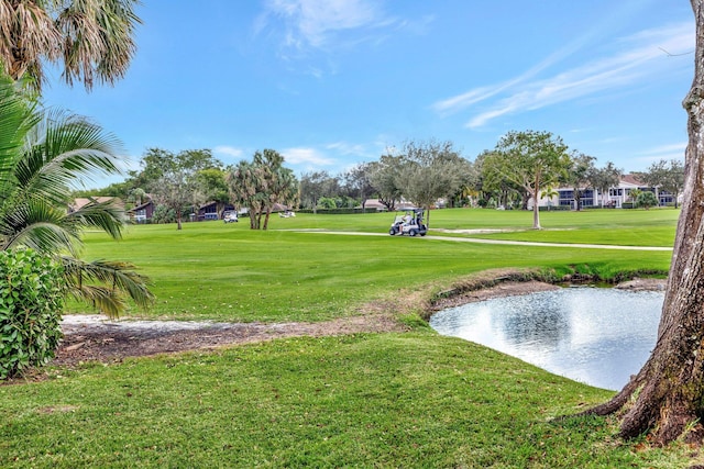 9010 S Lake Dasha Dr, Plantation, FL 33324 - view of property's community featuring view of golf course, a yard, and a water view