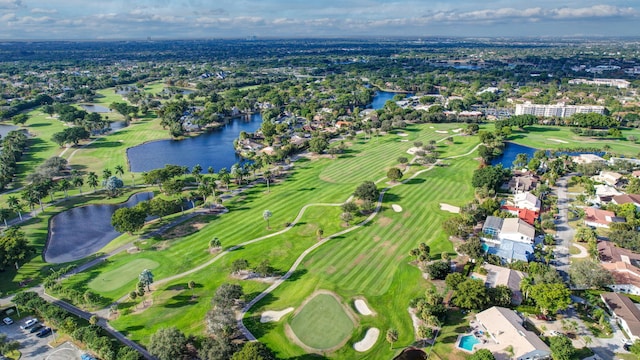 9010 S Lake Dasha Dr, Plantation, FL 33324 - aerial overview of property's location featuring a large body of water, a golf course, and nearby suburban area