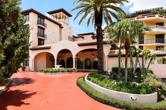 mediterranean / spanish house with a balcony