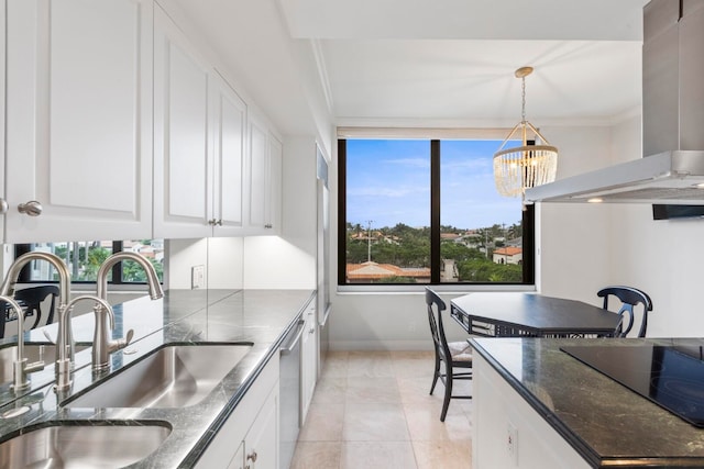 kitchen with a sink, white cabinets, dishwasher, wall chimney range hood, and decorative light fixtures