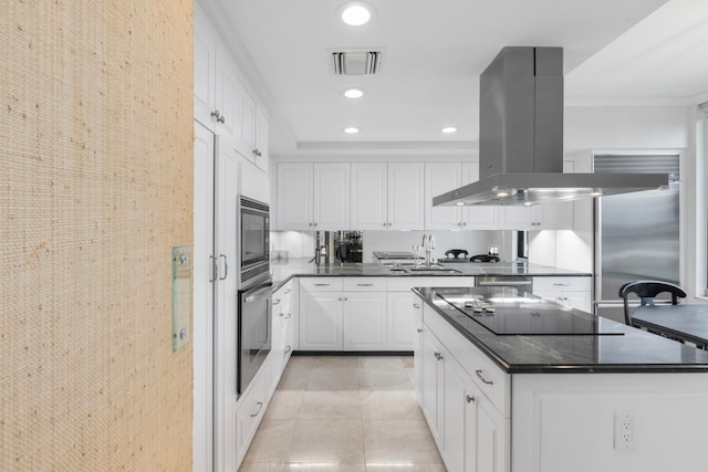 kitchen featuring sink, light tile floors, island exhaust hood, black appliances, and white cabinetry