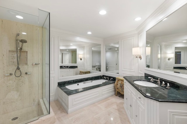 bathroom featuring independent shower and bath, vanity with extensive cabinet space, and tile flooring