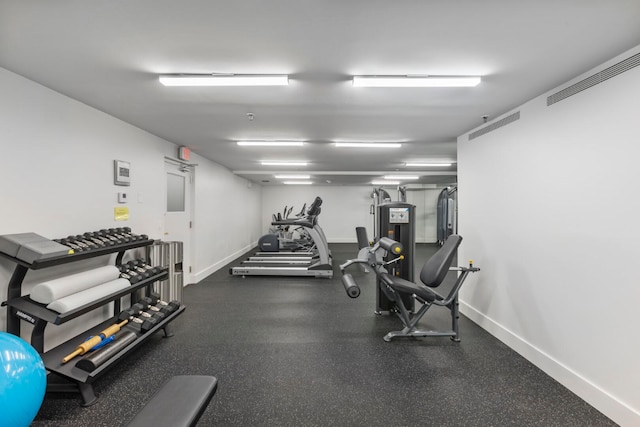 gym with baseboards and visible vents