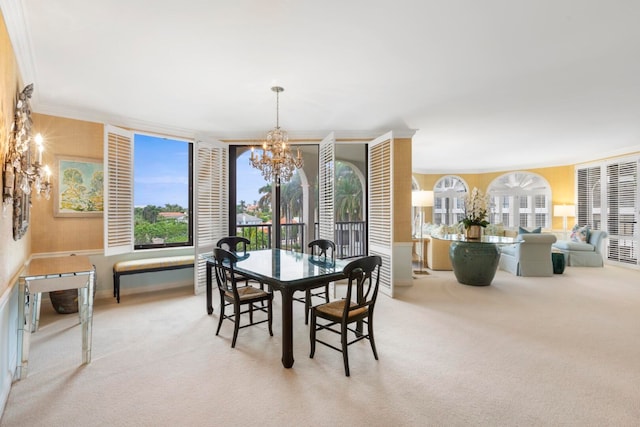 carpeted dining space with a notable chandelier and crown molding