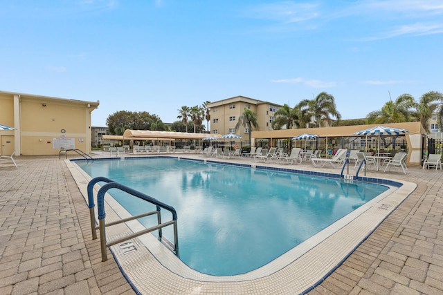 view of swimming pool featuring a patio