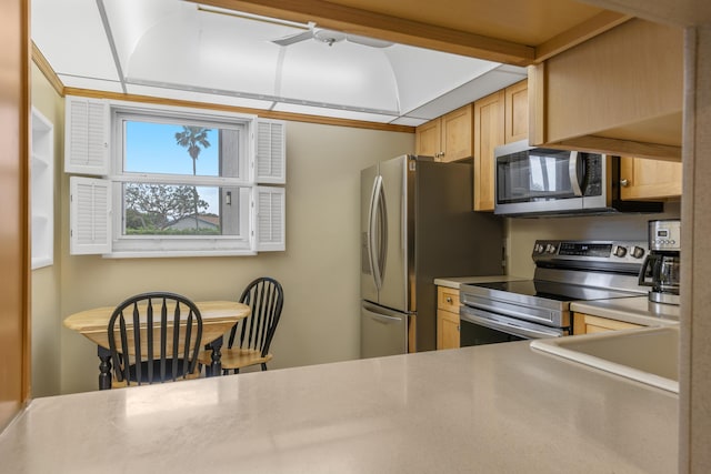 kitchen featuring sink, light brown cabinets, and stainless steel appliances