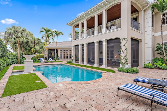 view of pool featuring a patio