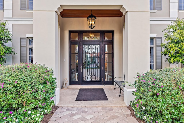 view of exterior entry featuring french doors