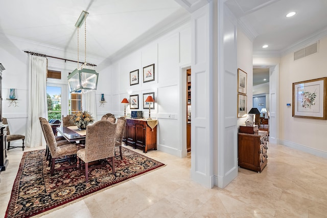 dining area featuring light tile flooring and ornamental molding