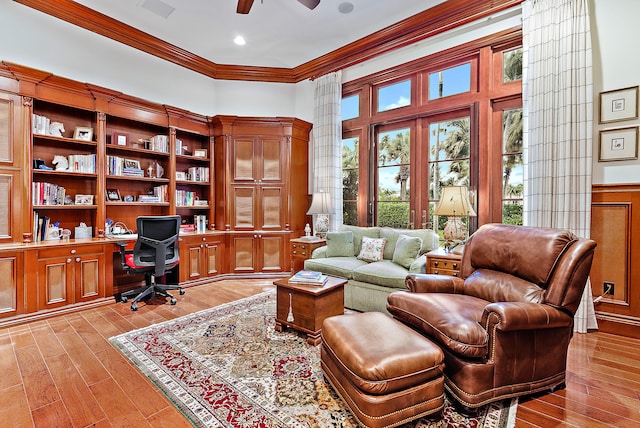 office area with crown molding, french doors, ceiling fan, and light hardwood / wood-style flooring