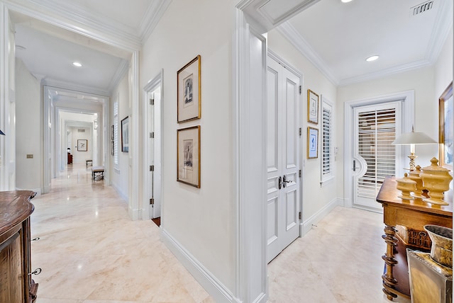 corridor featuring light tile floors and crown molding