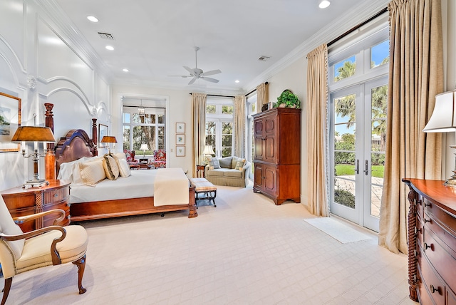 carpeted bedroom featuring access to outside, multiple windows, crown molding, and french doors