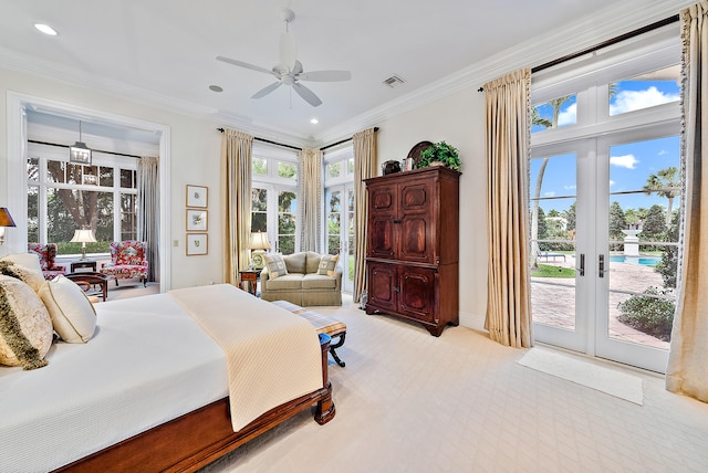 bedroom with ceiling fan, access to exterior, light carpet, crown molding, and french doors