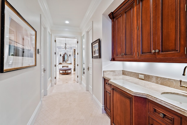 interior space with crown molding, light tile floors, sink, and an inviting chandelier