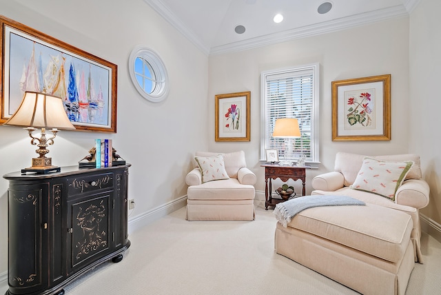 sitting room featuring ornamental molding, lofted ceiling, and light colored carpet