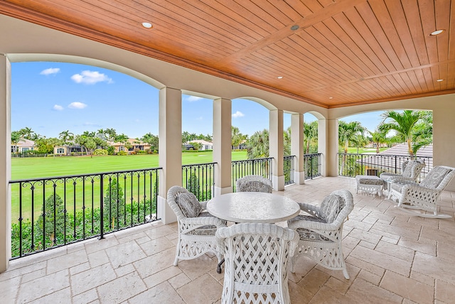 sunroom featuring wood ceiling