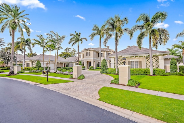 mediterranean / spanish home with a front yard